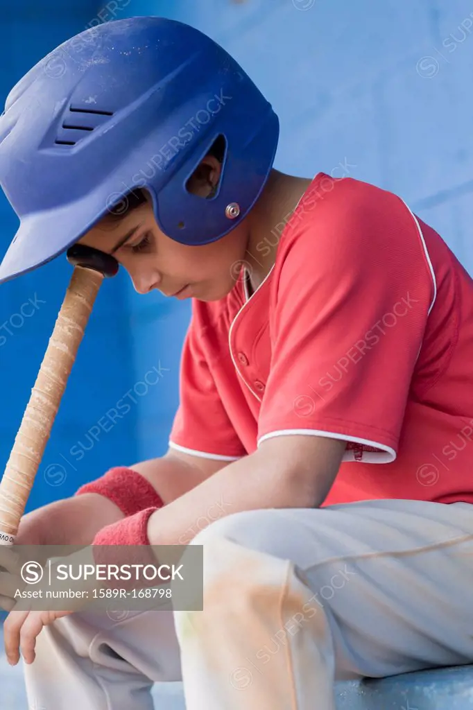Sad Hispanic baseball player