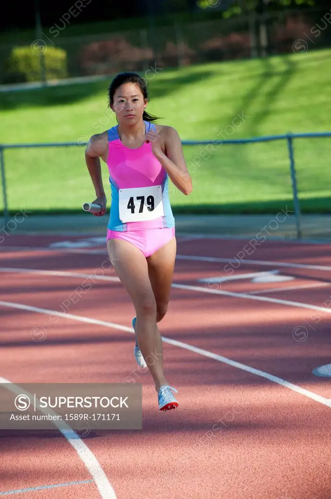 Japanese relay runner running with baton