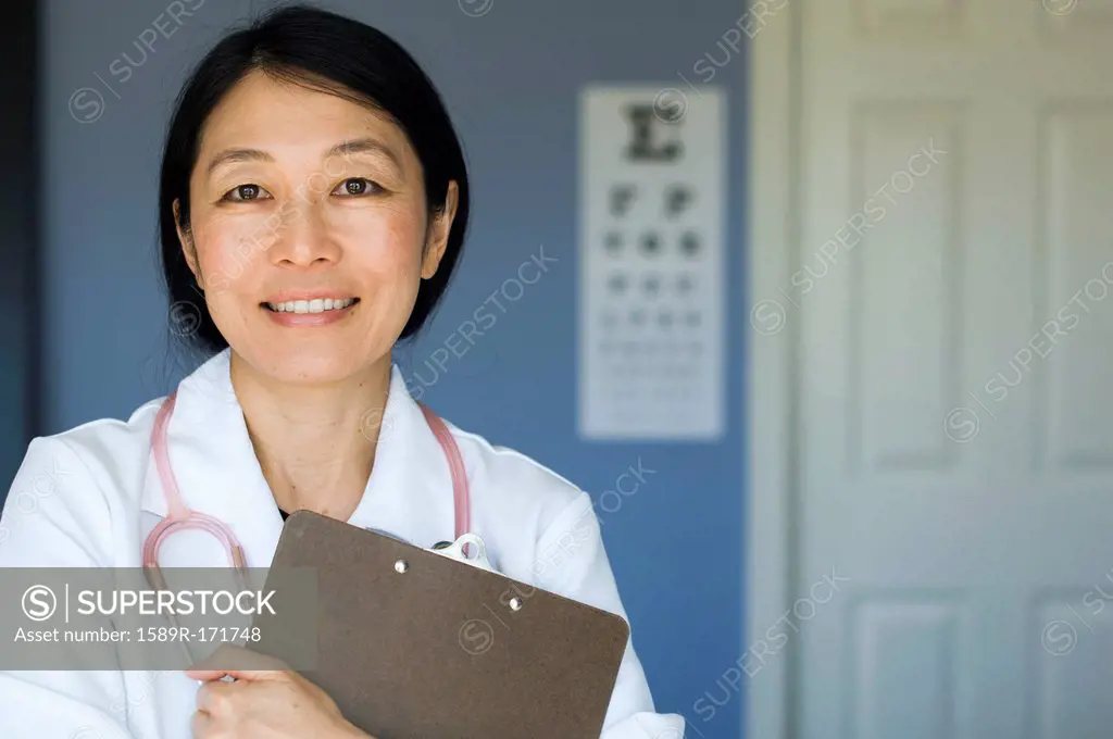 Japanese doctor standing in office