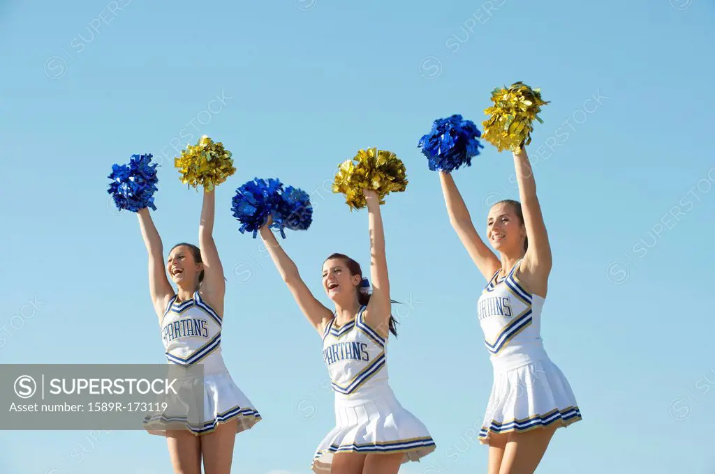 Caucasian cheerleaders posing together