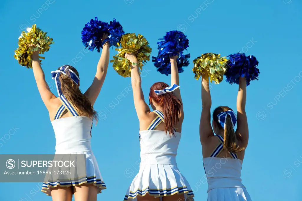Caucasian cheerleaders practicing together