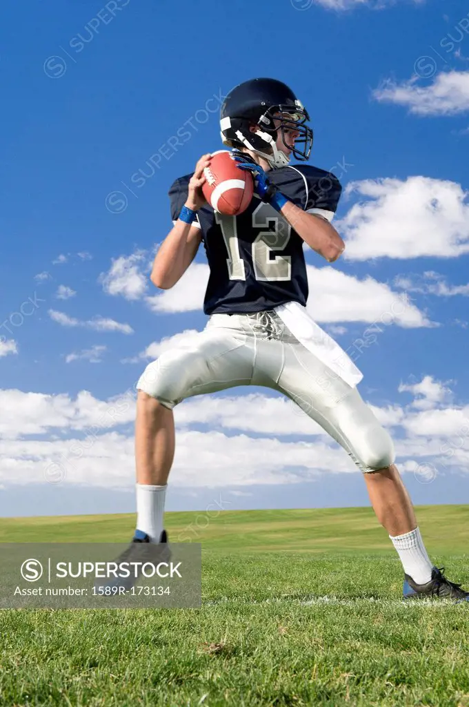 Caucasian football player poised on field