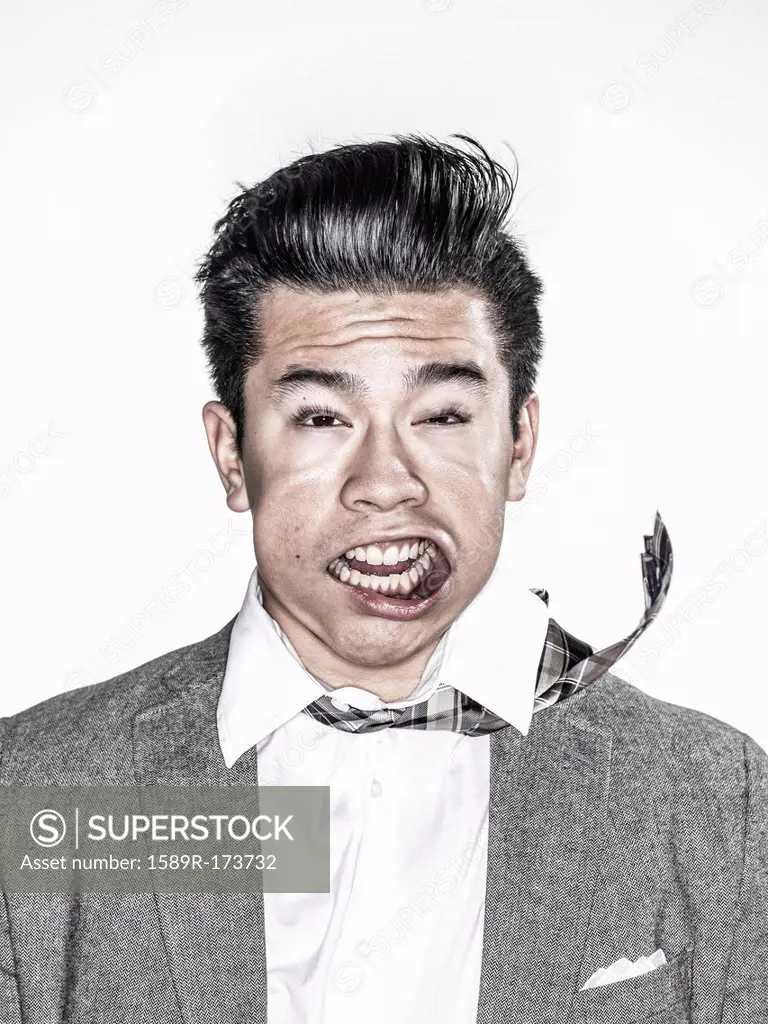 Businessman making face in wind