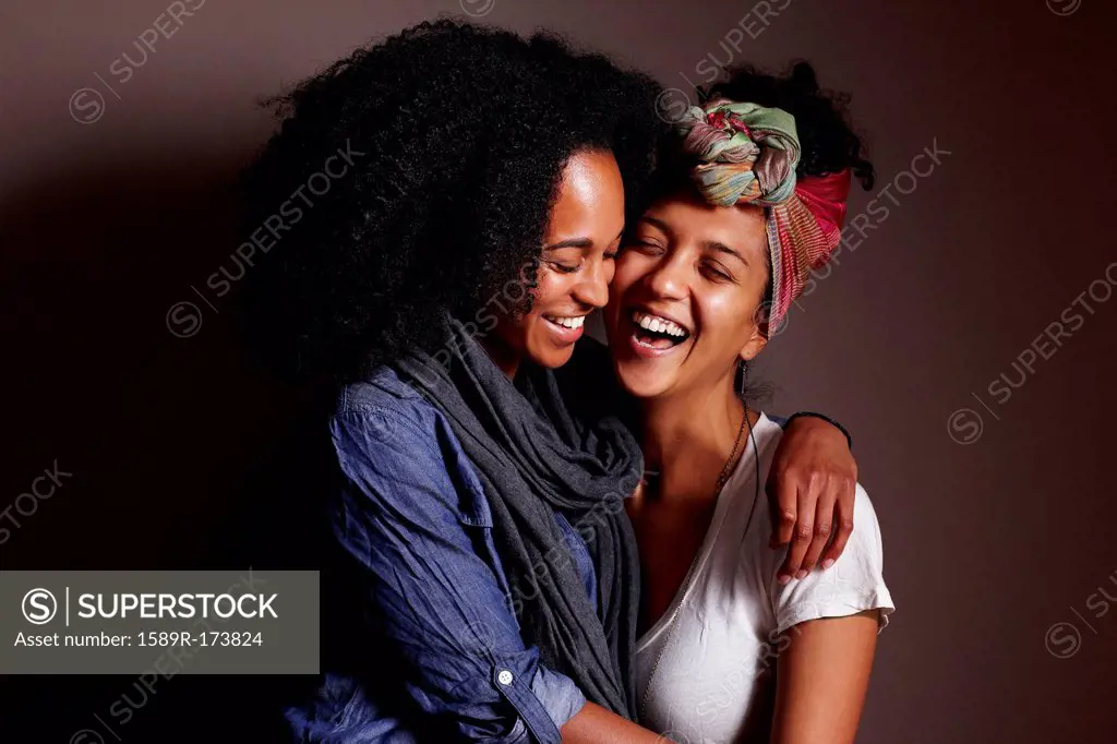 Smiling women hugging