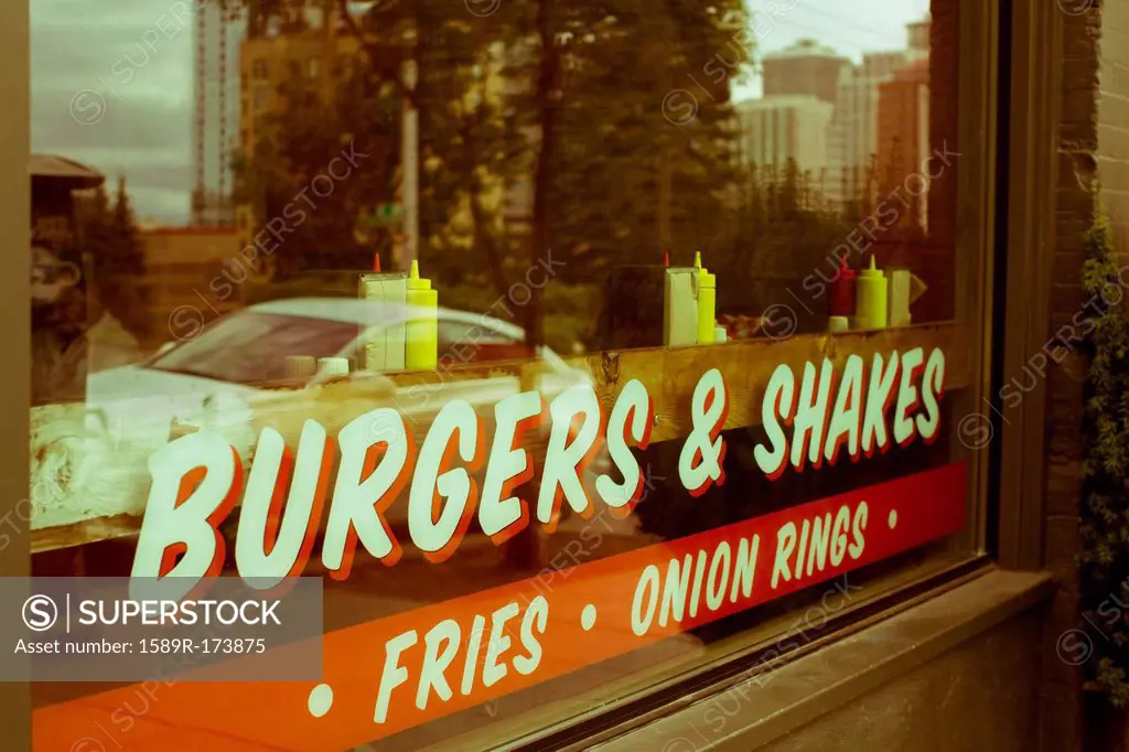 Sign reading burgers & shakes” on restaurant window