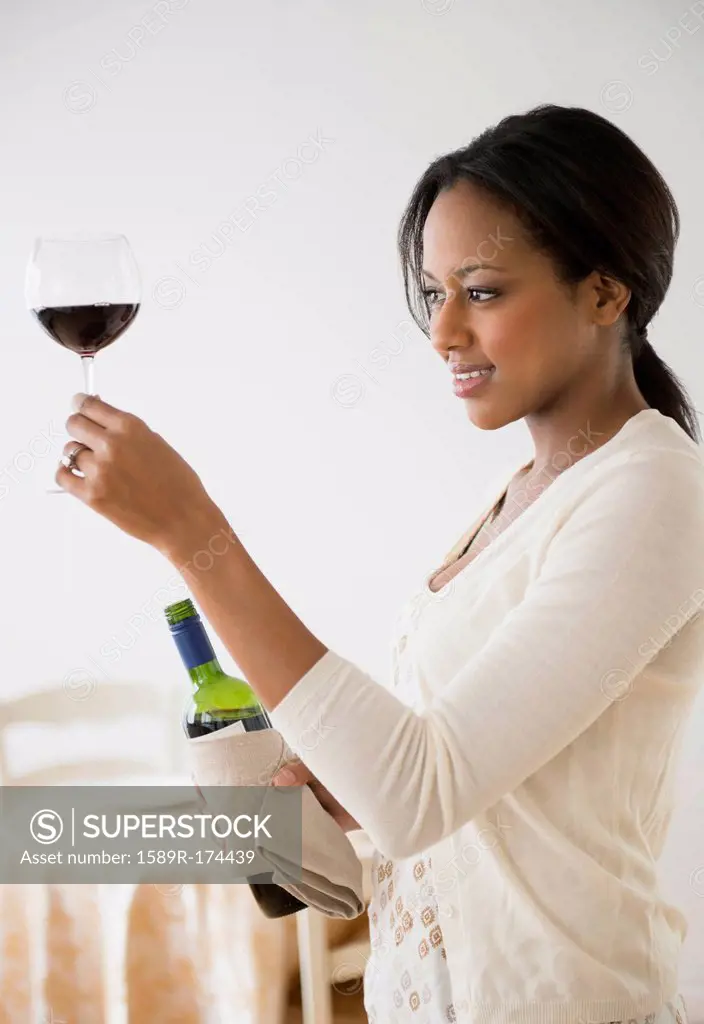 African American woman having glass of wine