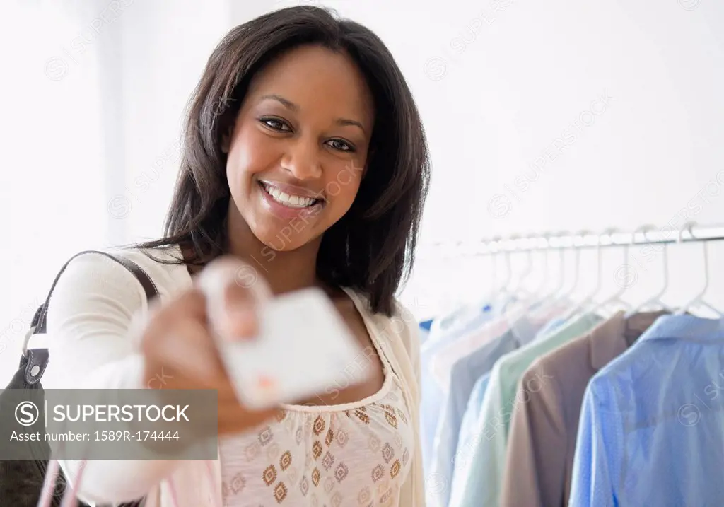 African American woman paying with credit card