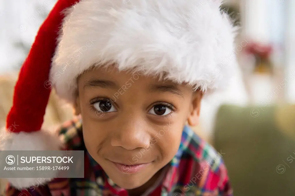 African American boy wearing Santa hat