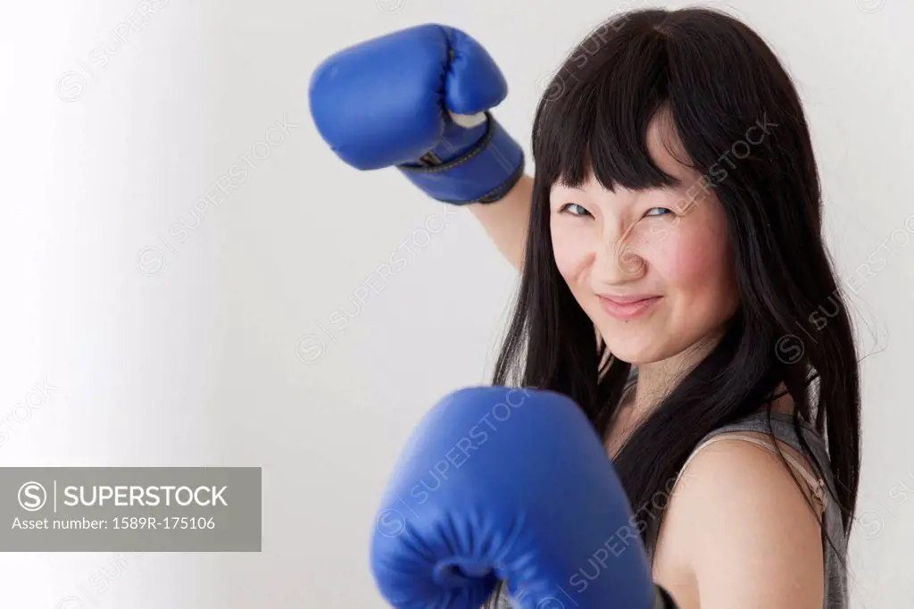 Chinese boxer with raised fists