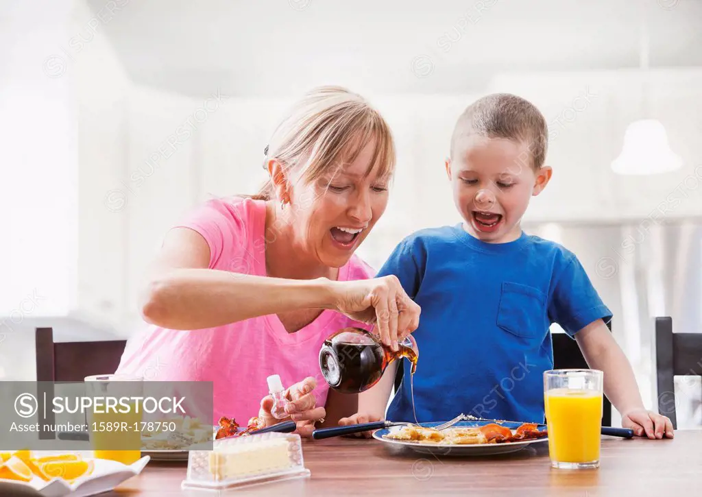 Caucasian mother and son having breakfast