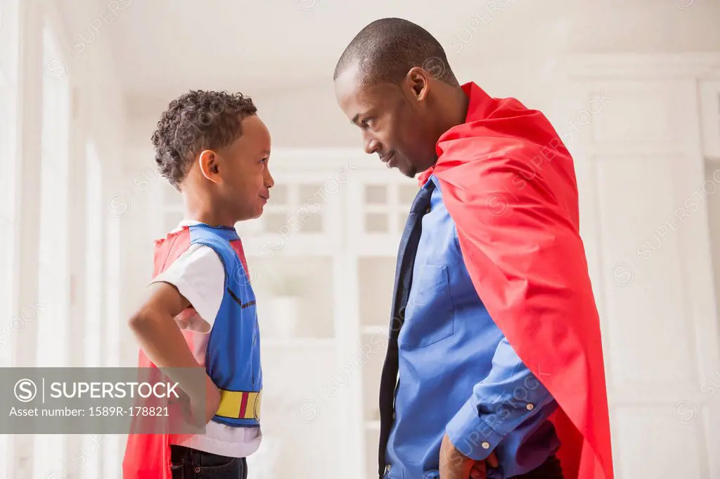 Father and son playing superhero