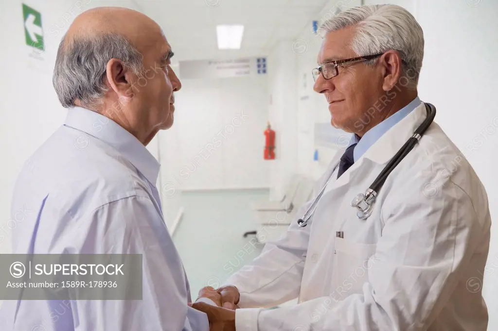 Hispanic doctor talking with patient