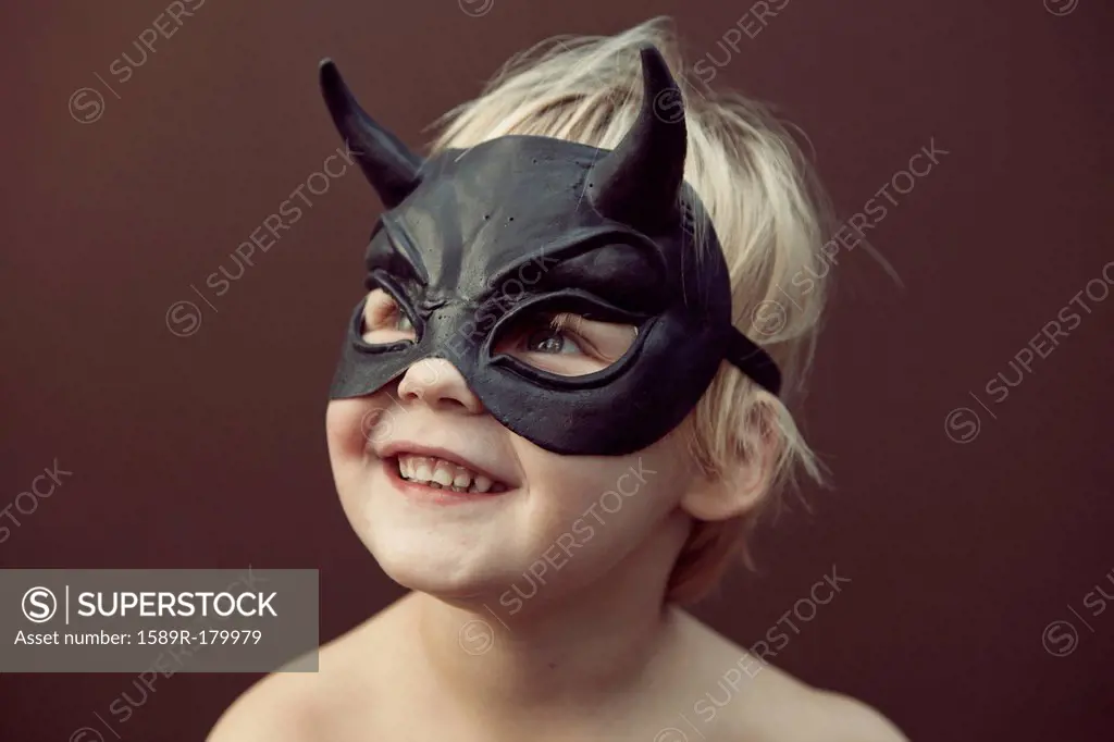 Caucasian boy wearing mask