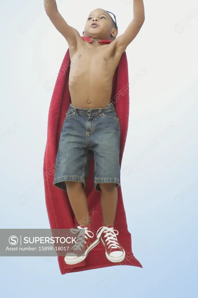 African American boy playing superhero