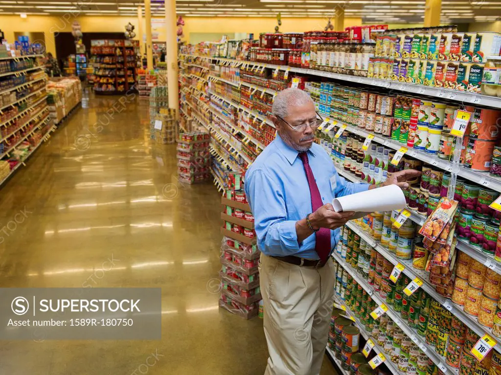African American businessman working in grocery store