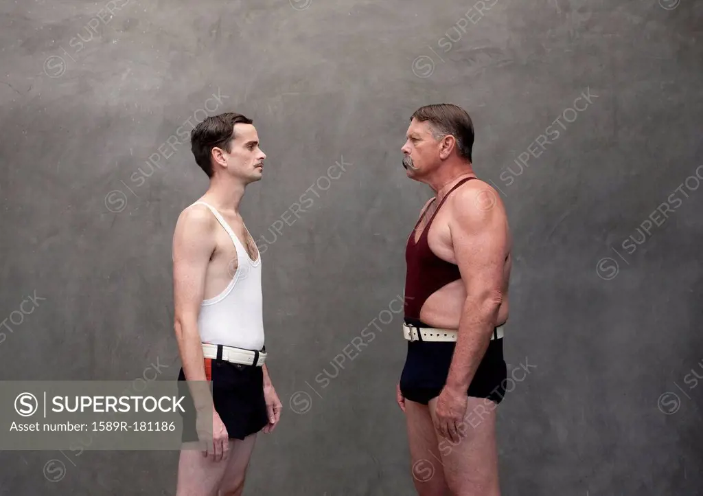Caucasian wrestlers examining each other