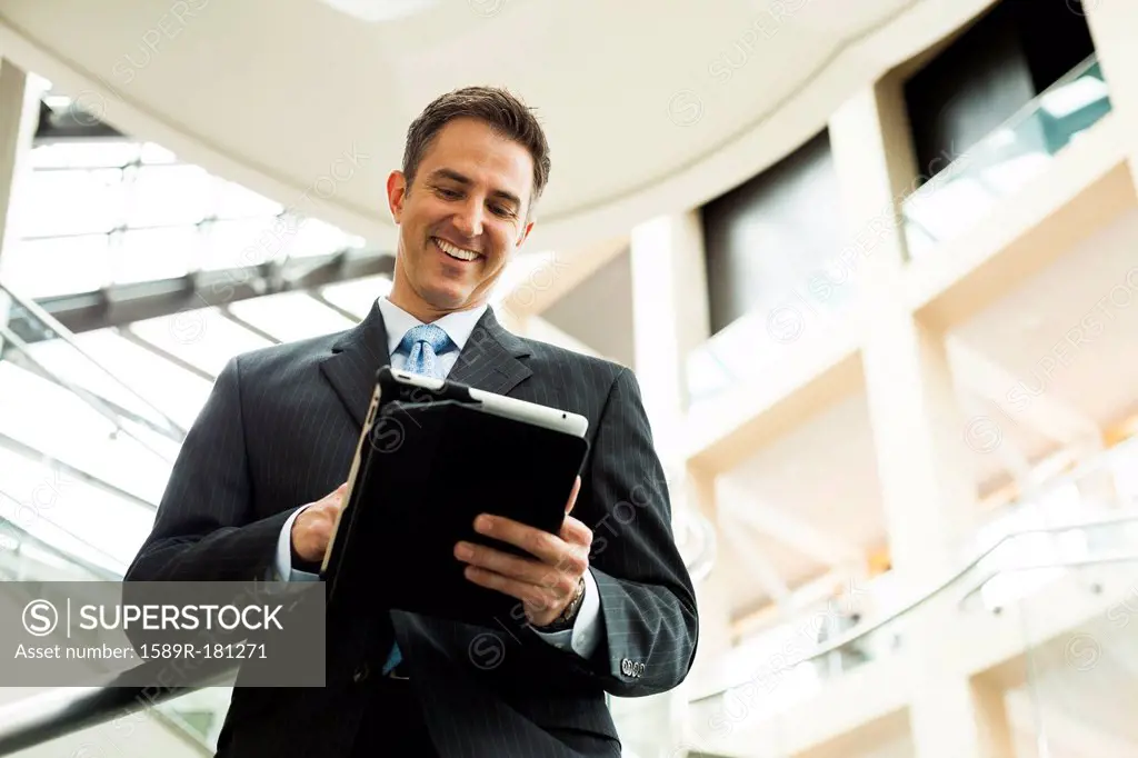 Caucasian businessman using digital tablet