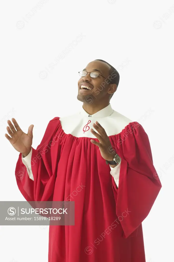 Man in choir robe singing