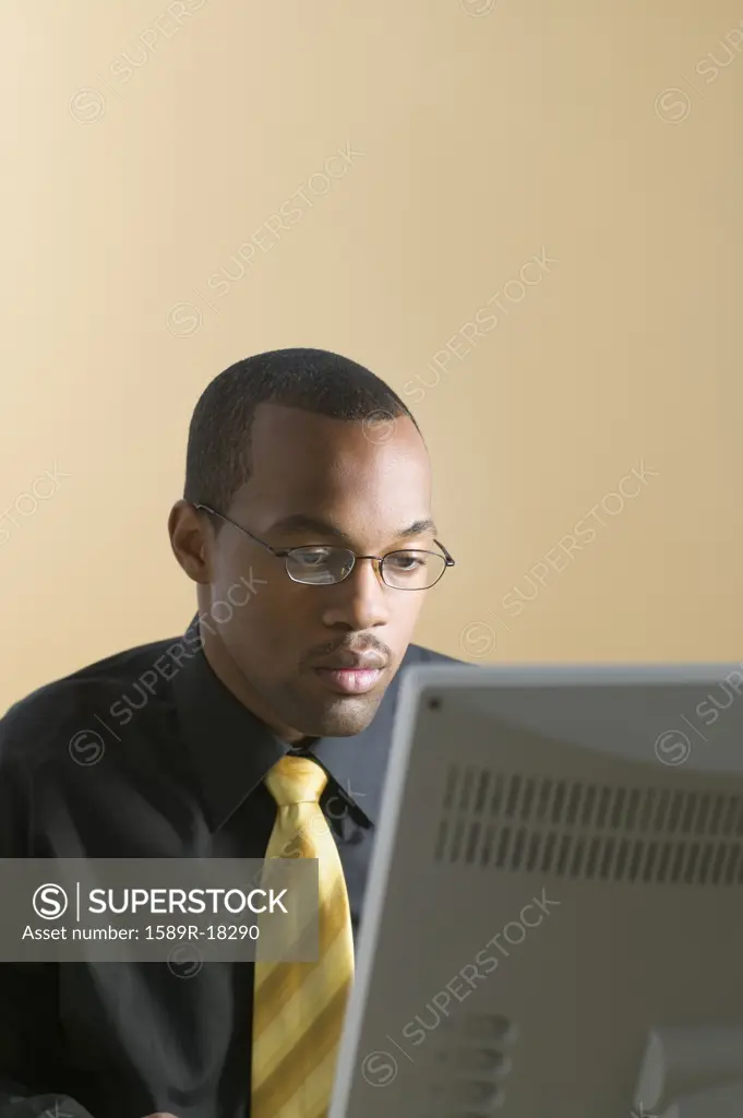 Businessman looking at computer screen