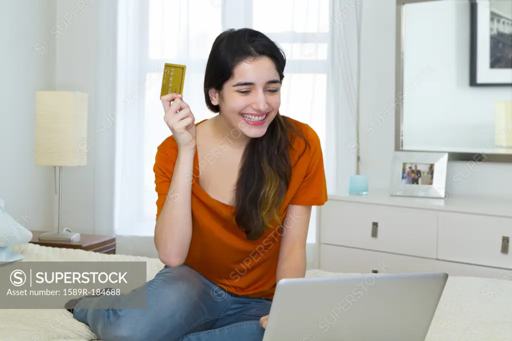 Hispanic woman shopping online