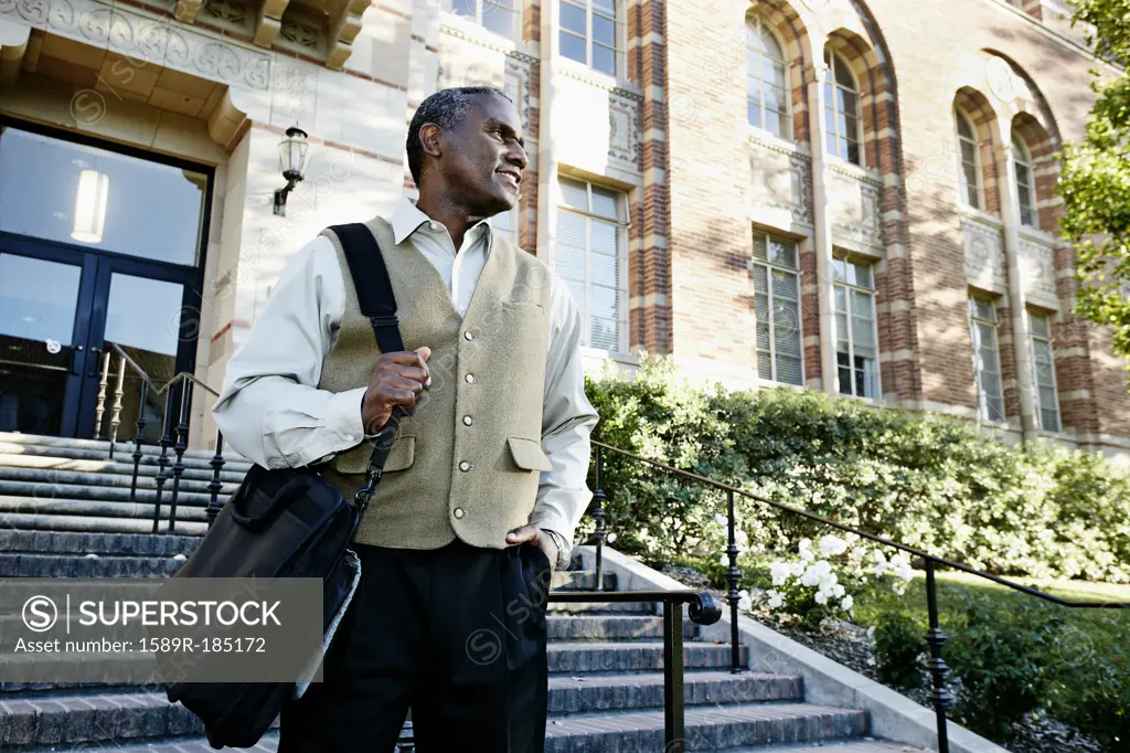 African American professor walking on campus