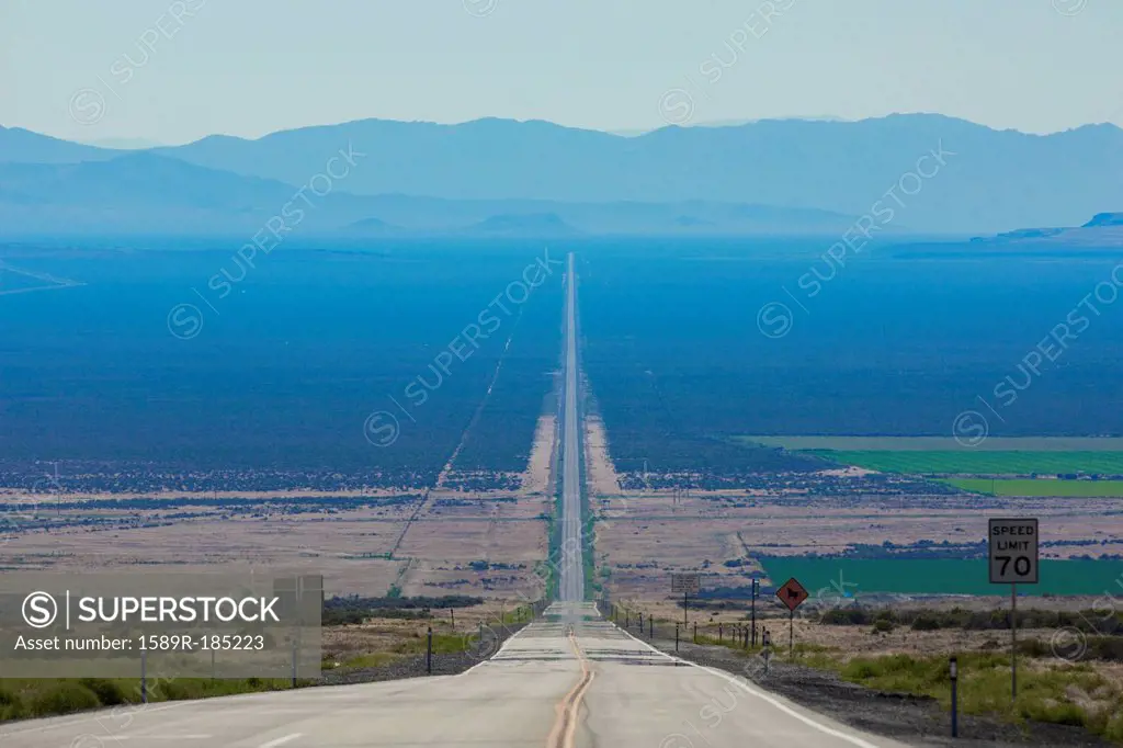 Long road through rural landscape, Orovada, Nevada, United States,