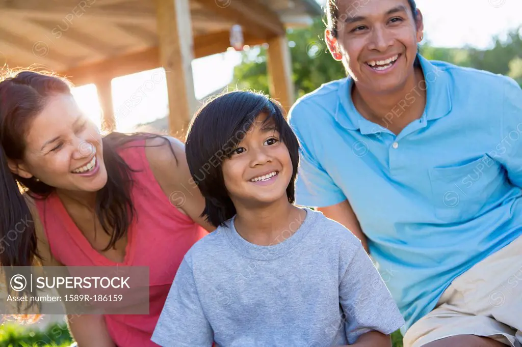 Family smiling outdoors