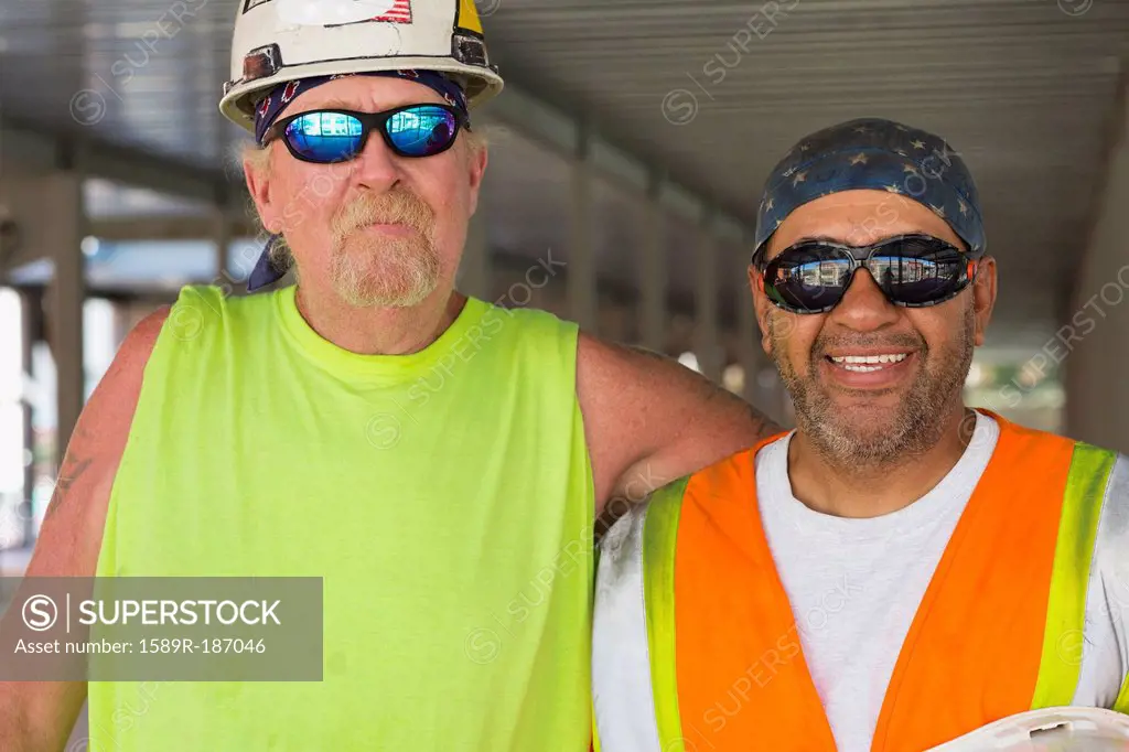 Workers smiling at construction site