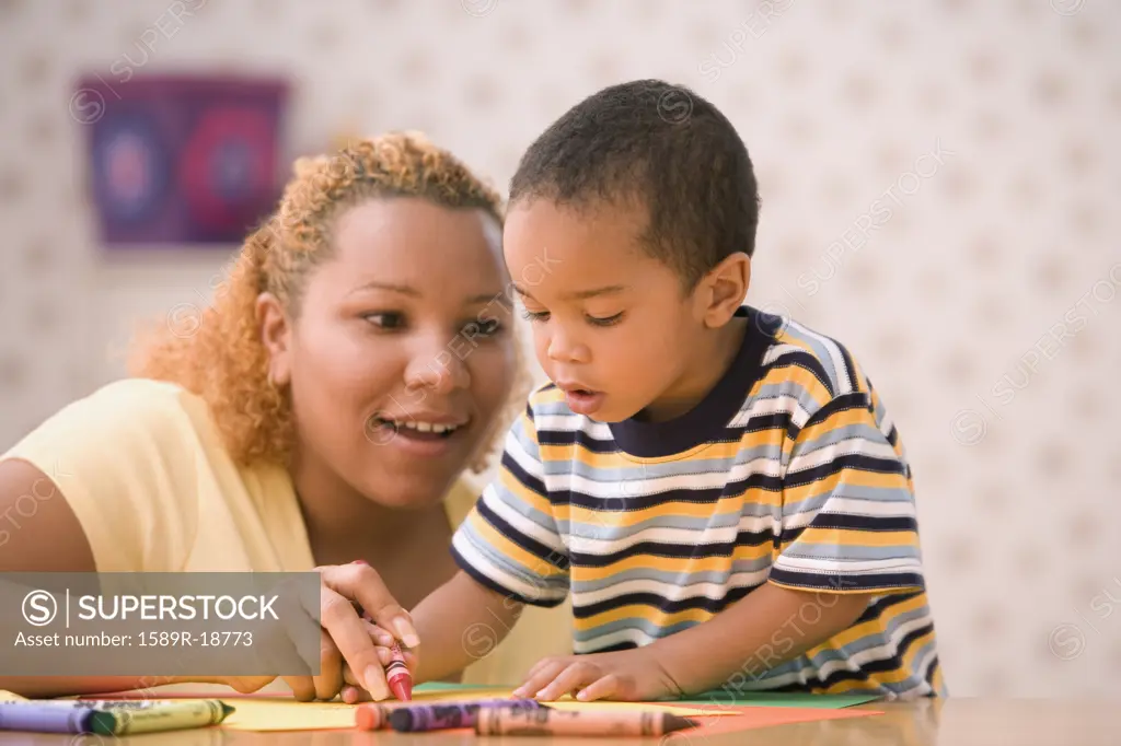 Mother coloring with son