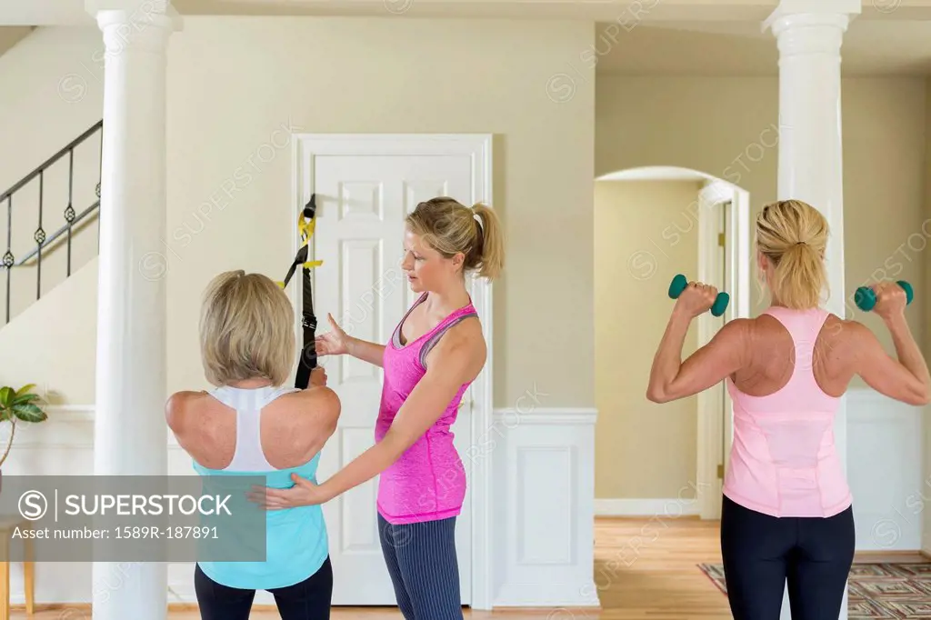 Caucasian women working with trainer in home