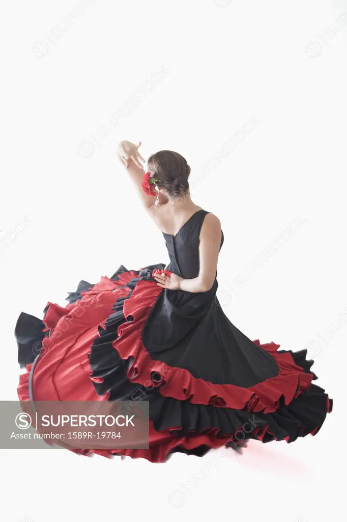 Salsa dancer twirling her skirts