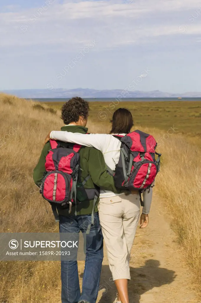 Rear view of couple hiking