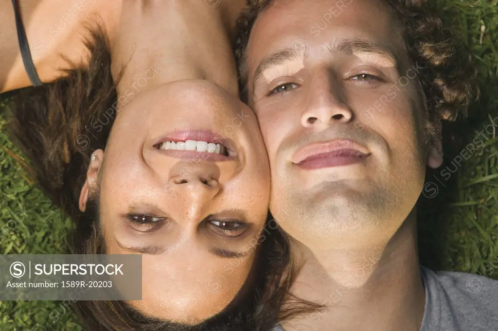 Close up portrait of couple head to head