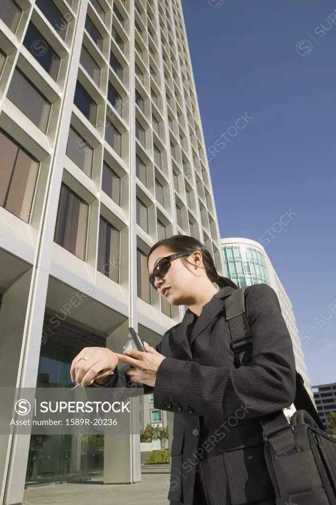 Businesswoman checking time on watch
