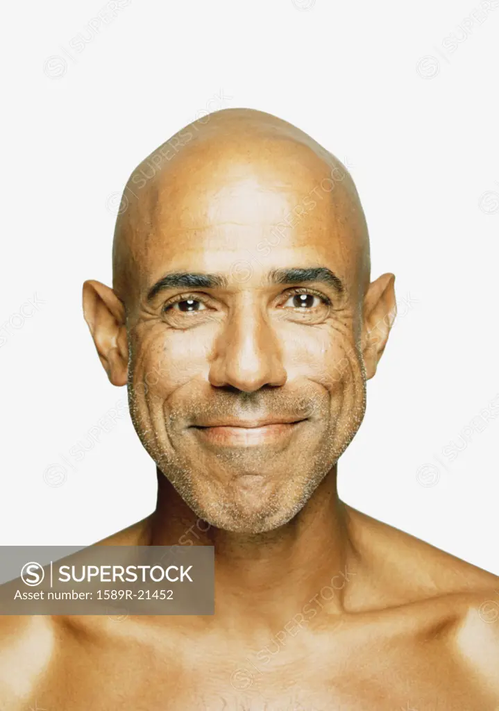 Bald man smiling for the camera