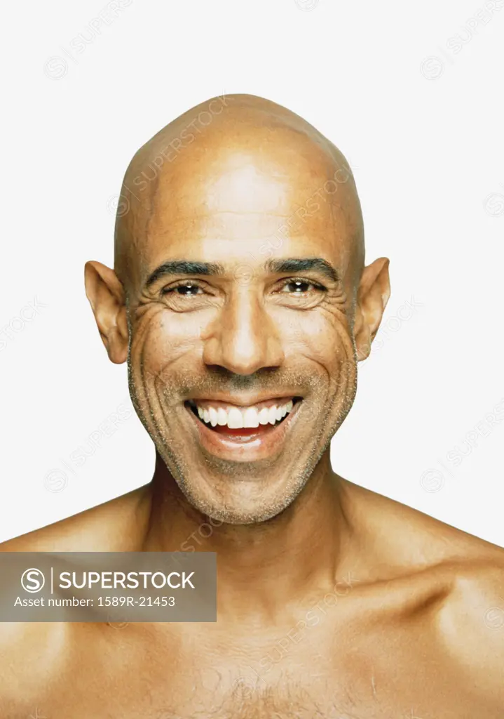 Bald man smiling for the camera
