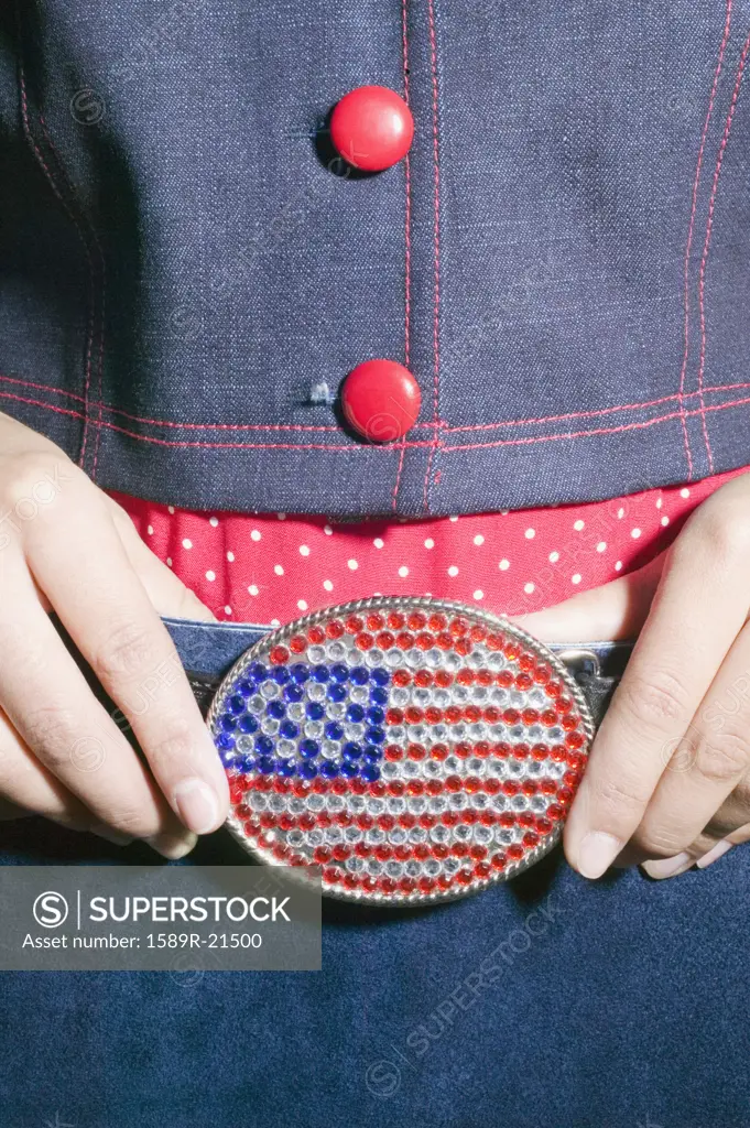 Close-up of young womans belt buckle