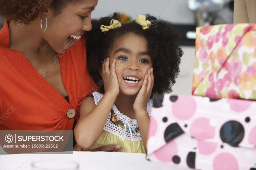 Young girl receiving birthday presents