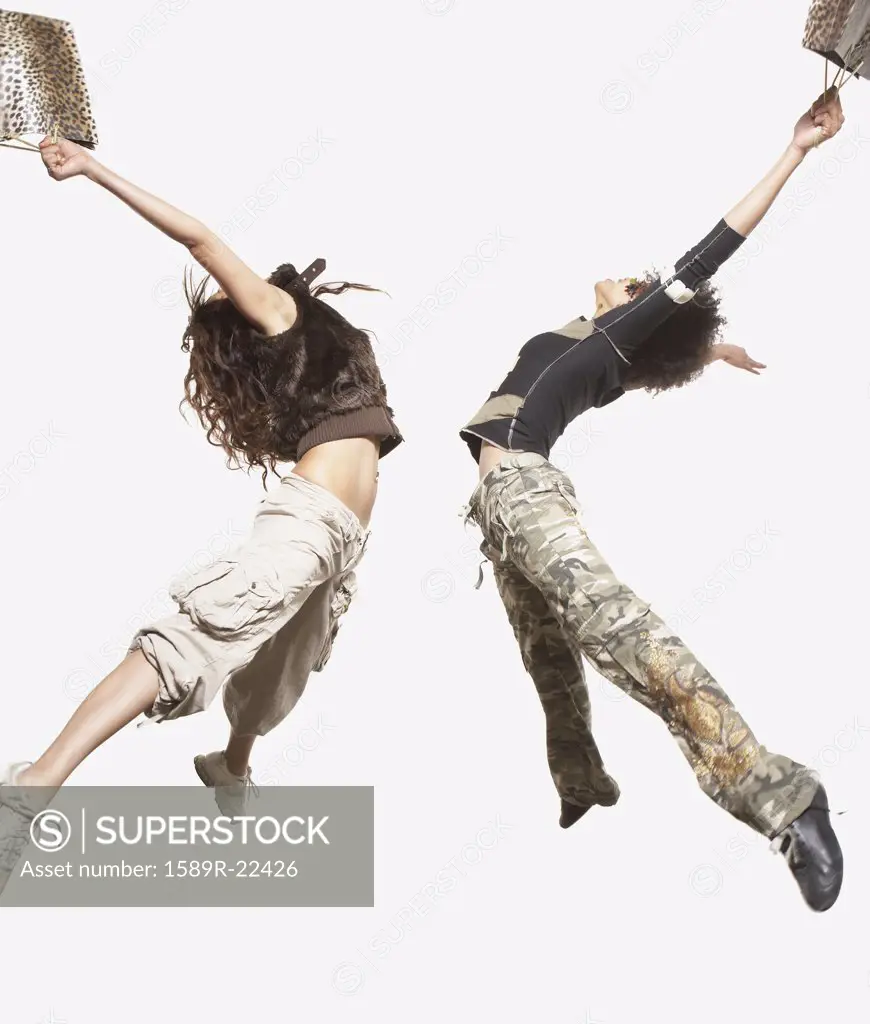 Women jumping for joy together