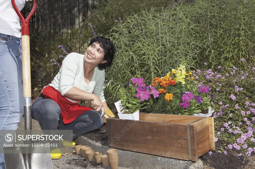 Middle aged woman gardening