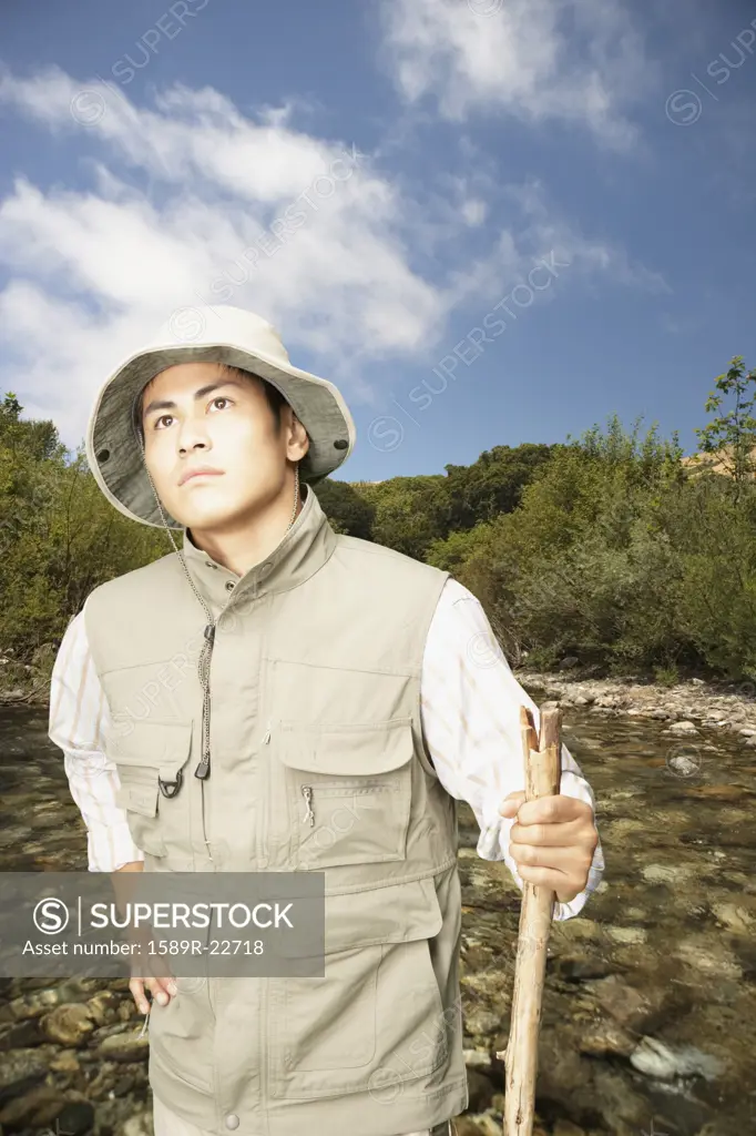 Explorer walking through riverbed