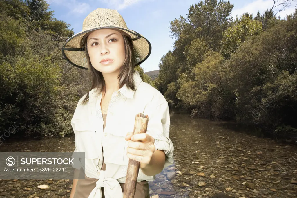 Explorer standing in riverbed