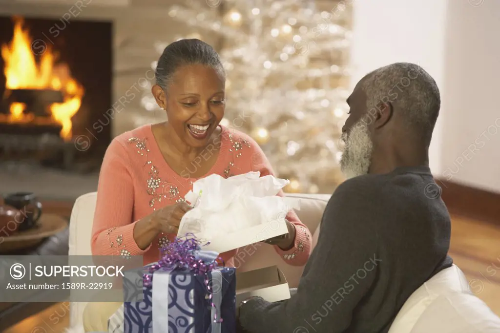 Senior African couple opening presents, Richmond, Virginia, United States