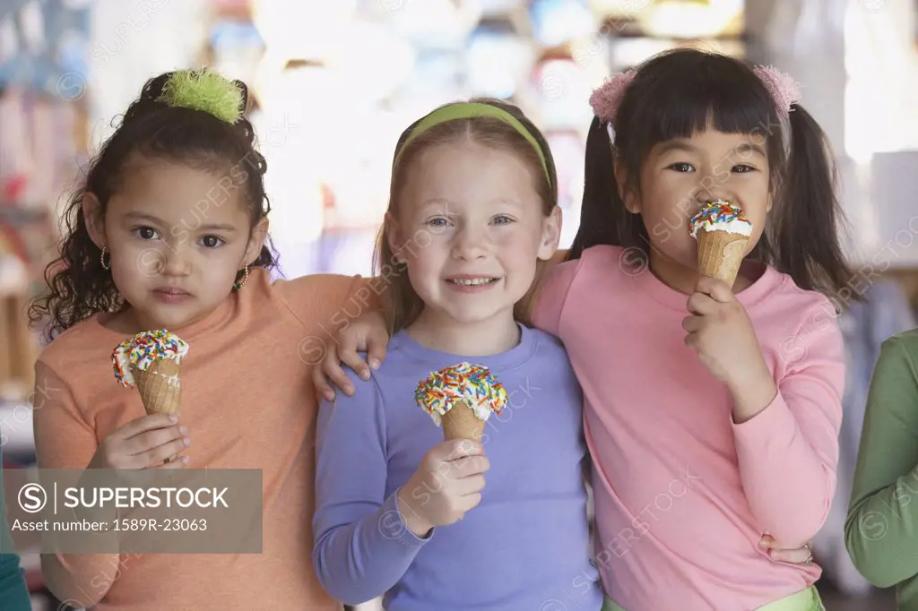 Group of young girls eating ice cream cones
