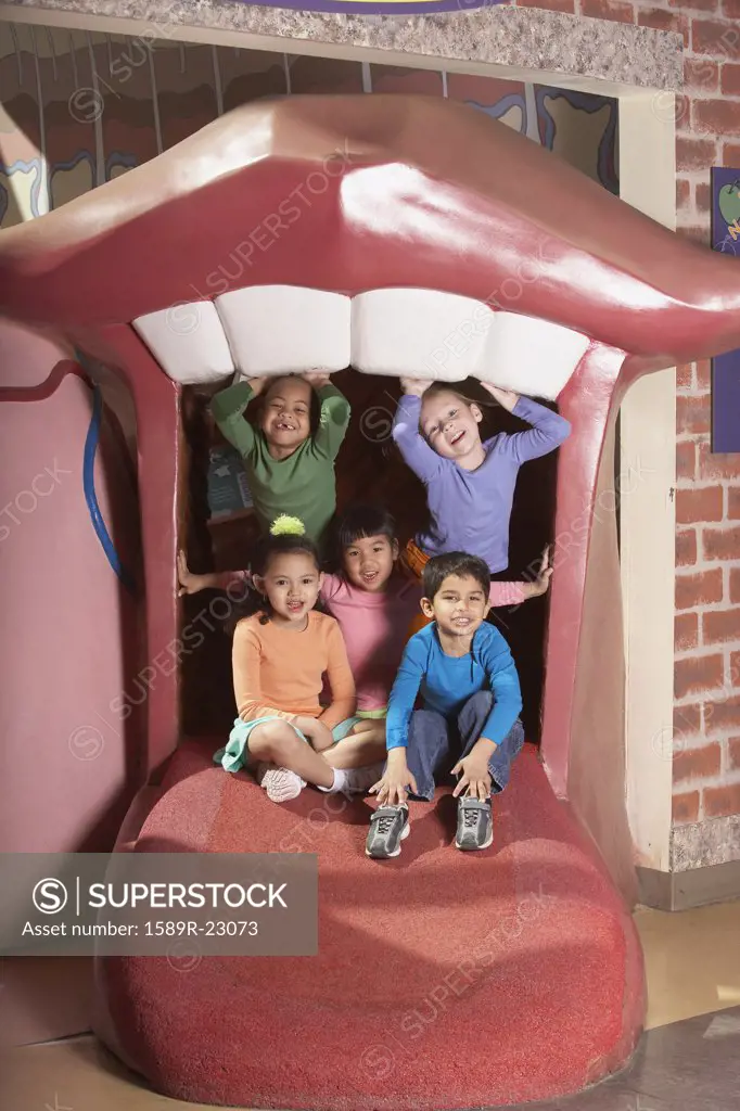 Group of young children on play structure