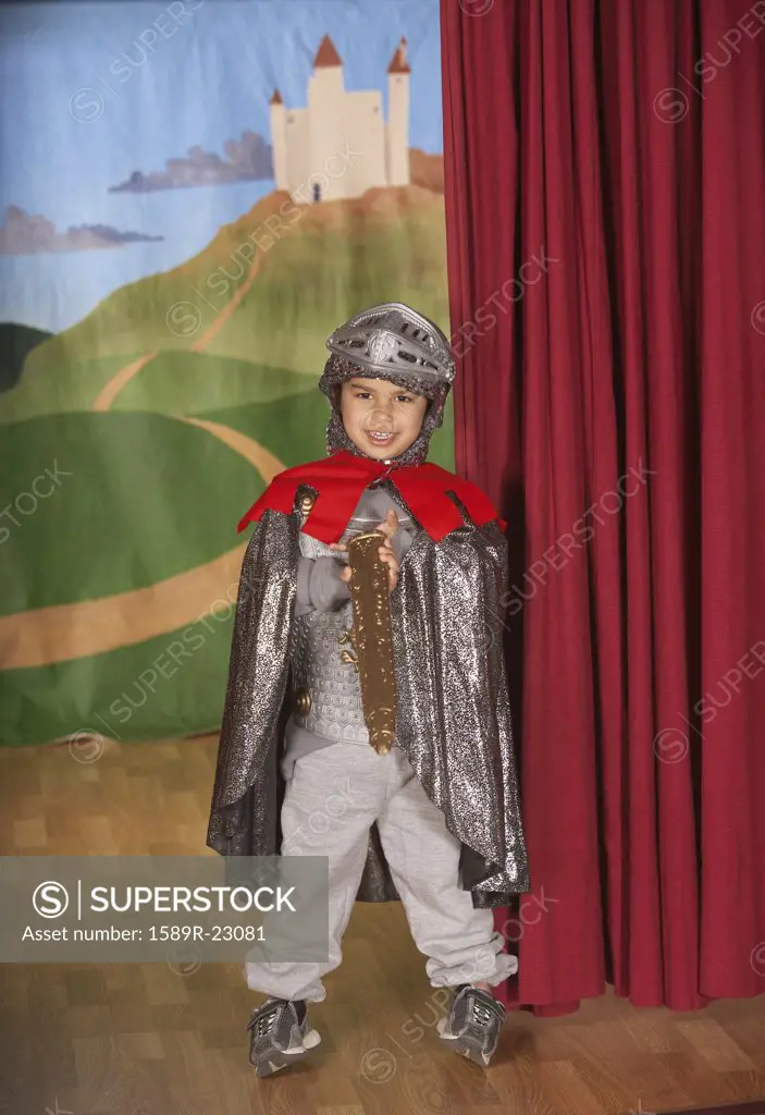 Young boy in knight costume on stage