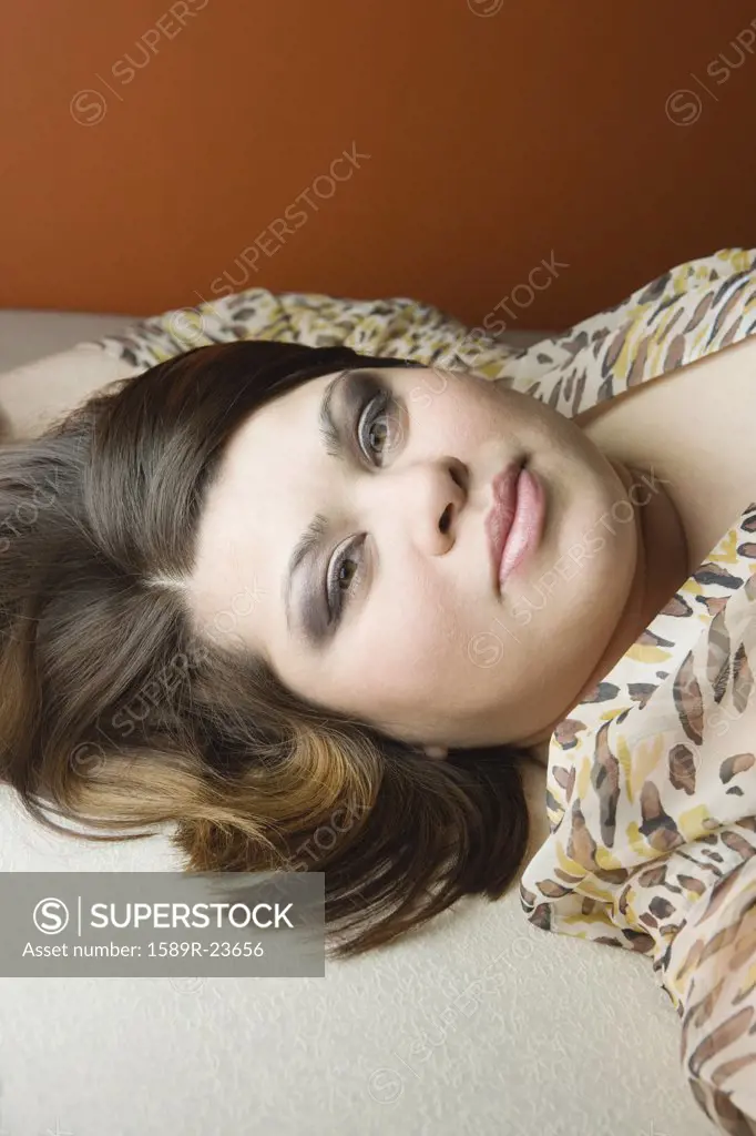 Close up of young woman lying on the floor