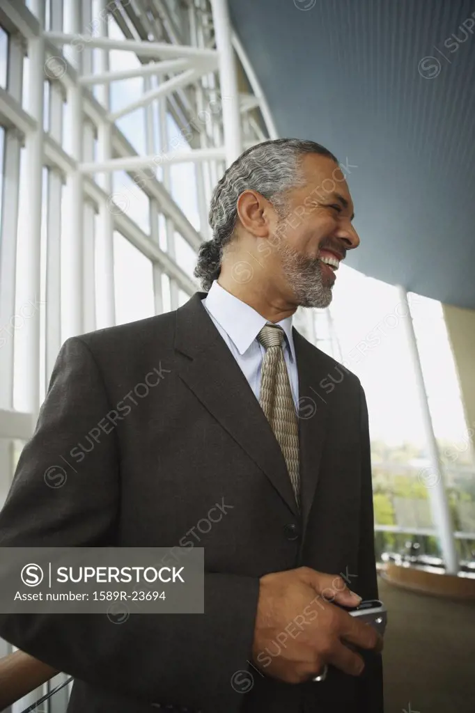 Middle-aged African businessman smiling, North Bethesda, Maryland, United States