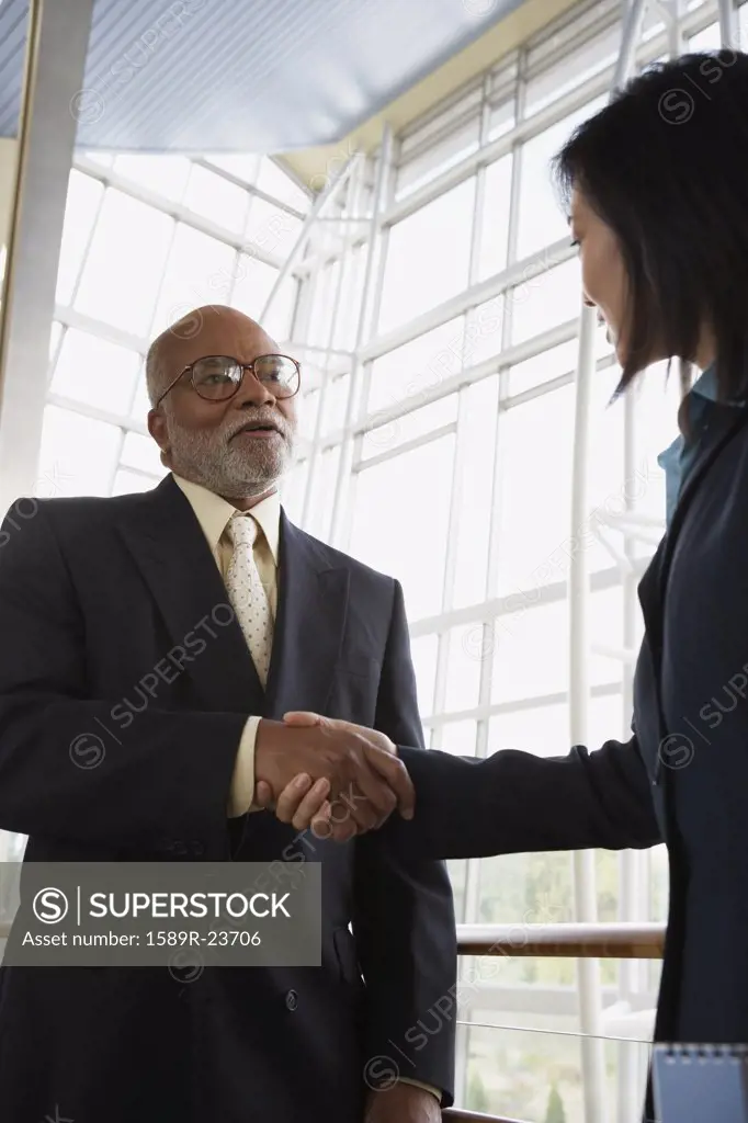 Two businesspeople shaking hands, North Bethesda, Maryland, United States