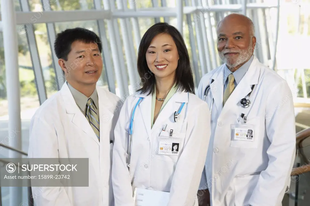 Young female Asian doctor with two middle-aged male doctors, North Bethesda, Maryland, United States